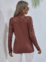 Light Mauve lace inset blouse with long sleeves and a mock neck.