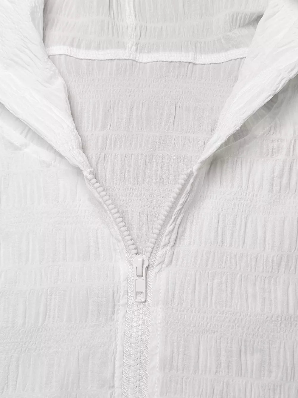 White textured lightweight hooded jacket with crinkled fabric and white zipper.