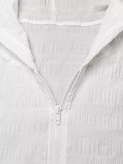 White textured lightweight hooded jacket with crinkled fabric and white zipper.