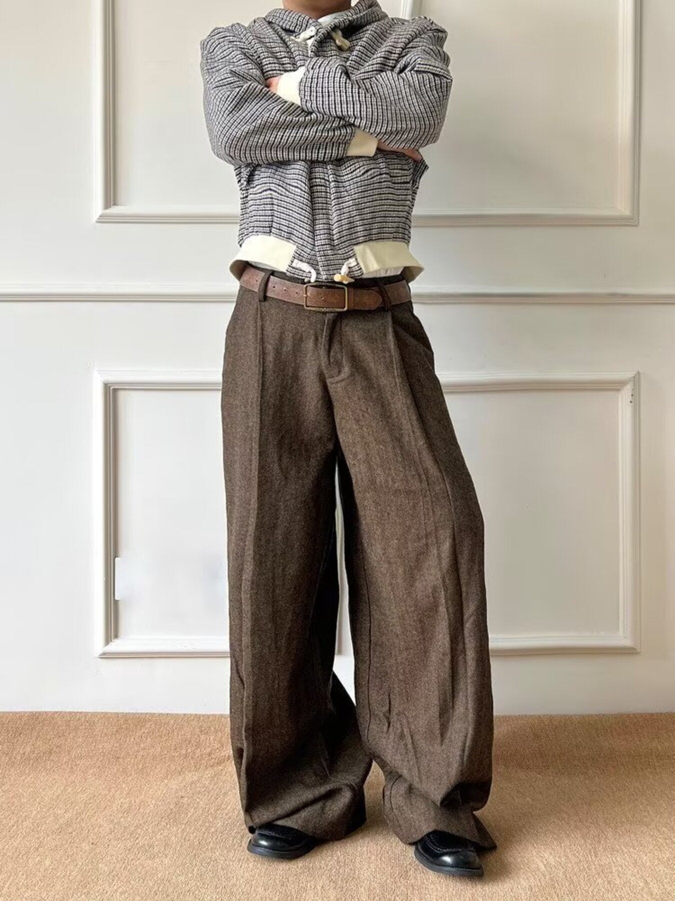 Men's brown wide-leg trousers with a textured weave and a relaxed fit.