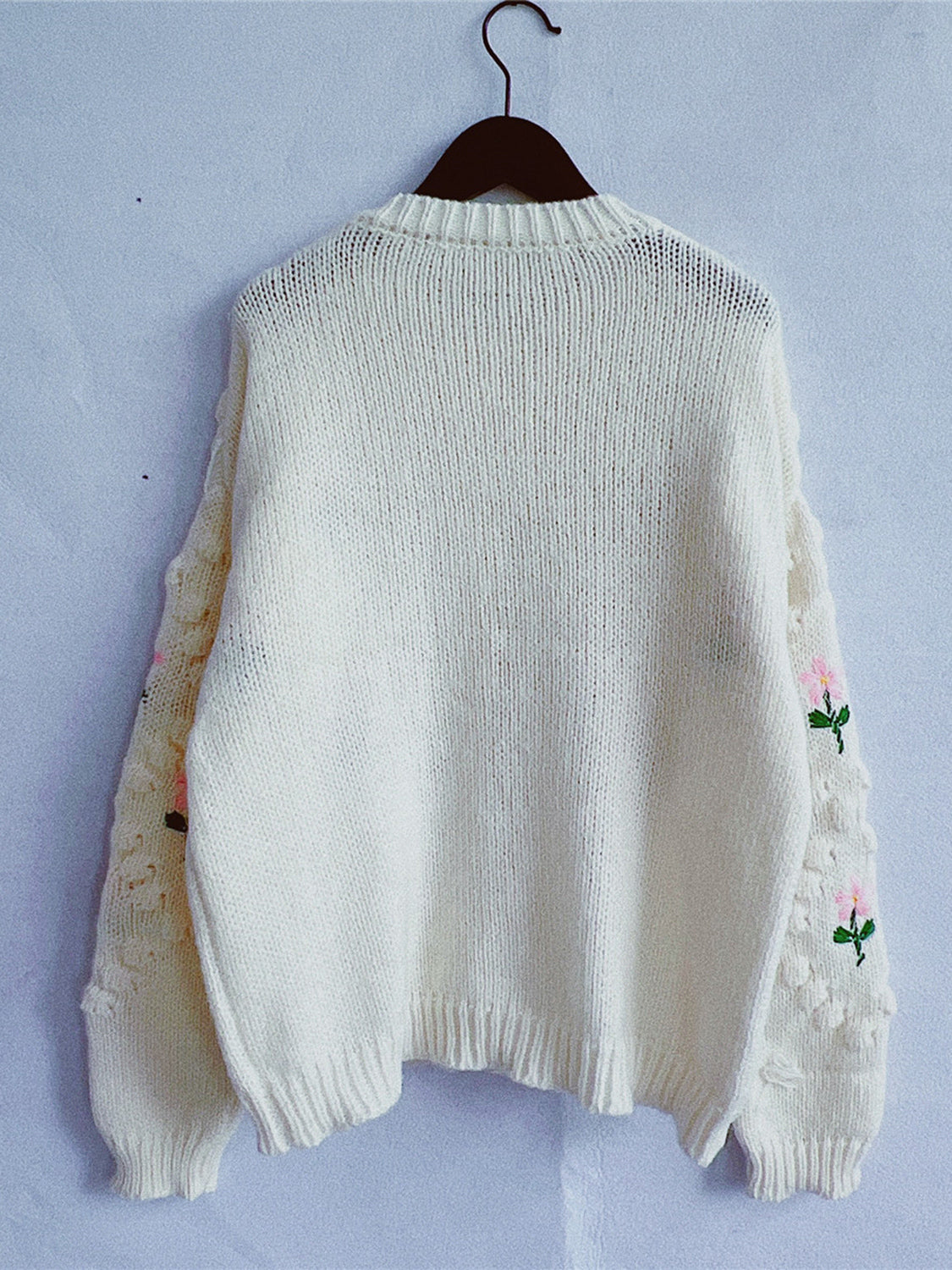 Cream bobble stitch cardigan with embroidered floral sleeves and pearl buttons