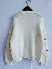Cream bobble stitch cardigan with embroidered floral sleeves and pearl buttons