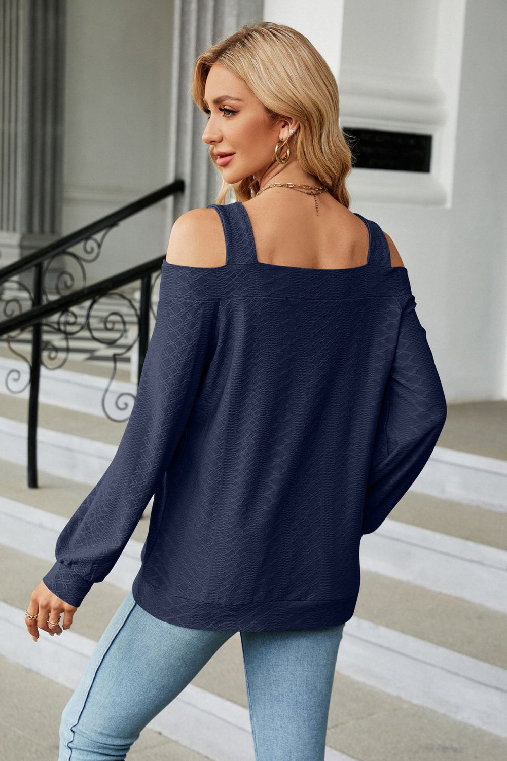 Dark Blue textured open shoulder blouse with square neckline and long sleeves.