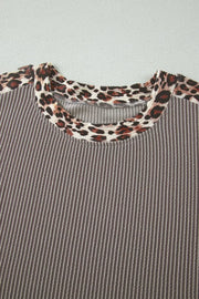 Ribbed knit two-piece set with leopard trim neckline and cuffs.