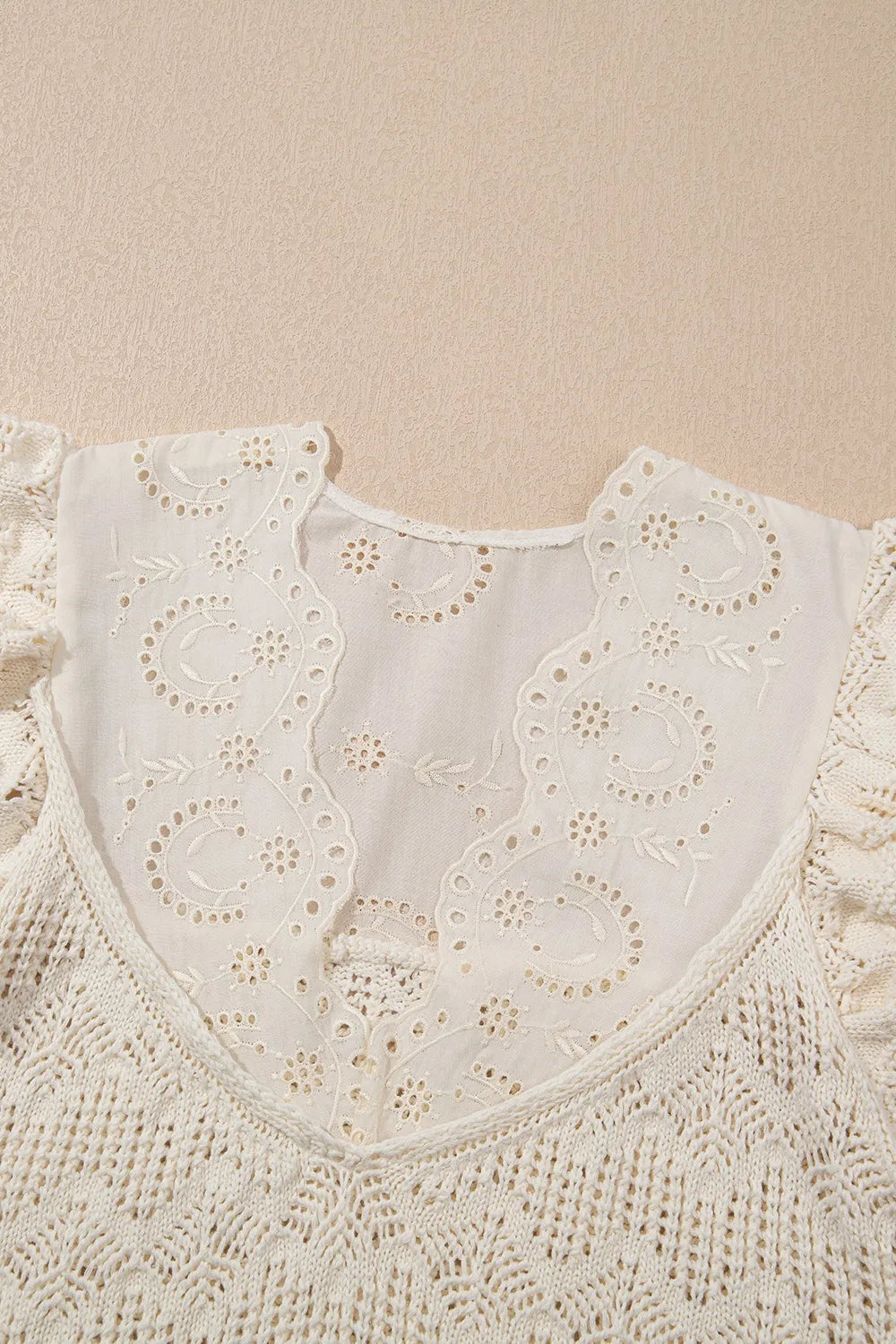 Beige crochet knit vest with eyelet yoke and embroidered details