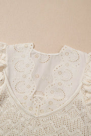Beige crochet knit vest with eyelet yoke and embroidered details