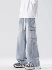 Light blue oversized cargo jeans with drawstring waist and large side pockets.