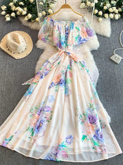 Botanical off-shoulder A-line dress in light pink with floral print, ruffled sleeves, and belted waist.