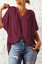Wine relaxed V-neck blouse with gathered shoulders and cap sleeves.