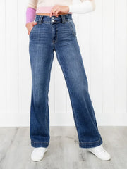 Medium wash denim jeans with wide legs and utility pockets.