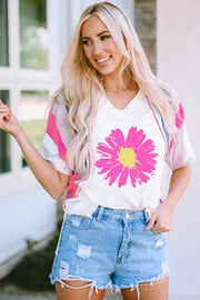 White graphic tee with pink floral print and colorblock sleeves