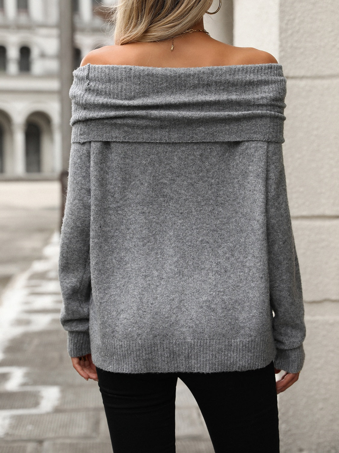Gray cowl neck knit pullover sweater with off-the-shoulder neckline and ribbed details.