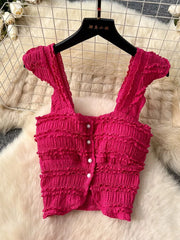 Rose red textured crop top with ruffled details and button front.