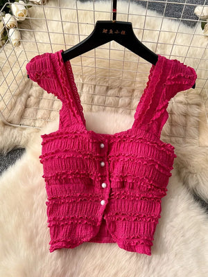 Rose red textured crop top with ruffled details and button front.