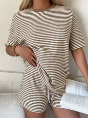 Khaki striped two-piece set with drawstring shorts and short sleeve top.