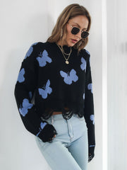 Black cropped knit sweater with distressed hem and light blue butterfly print.
