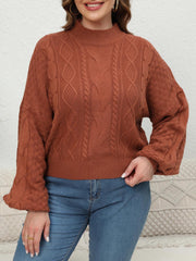Ochre cable knit sweater with mock neck and balloon sleeves.