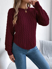 Burgundy cable knit sweater with asymmetric hem and crew neck.