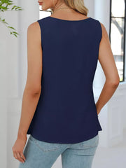 Navy blue V-neck pleated tank top with a textured fabric and a relaxed fit.