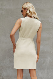 Belted knit tank dress in cream with a ribbed texture and A-line cut.