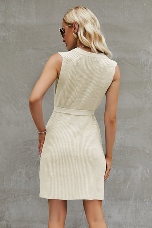 Belted knit tank dress in cream with a ribbed texture and A-line cut.