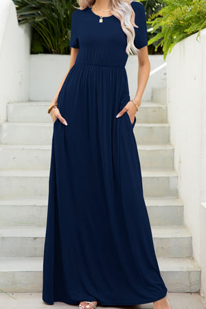 Navy gathered waist maxi dress with pockets and short sleeves, crew neck.