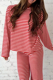 Chic red and white striped loungewear set with long sleeves and pants.