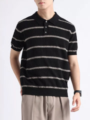 Black striped knit polo shirt with button accents and short sleeves.