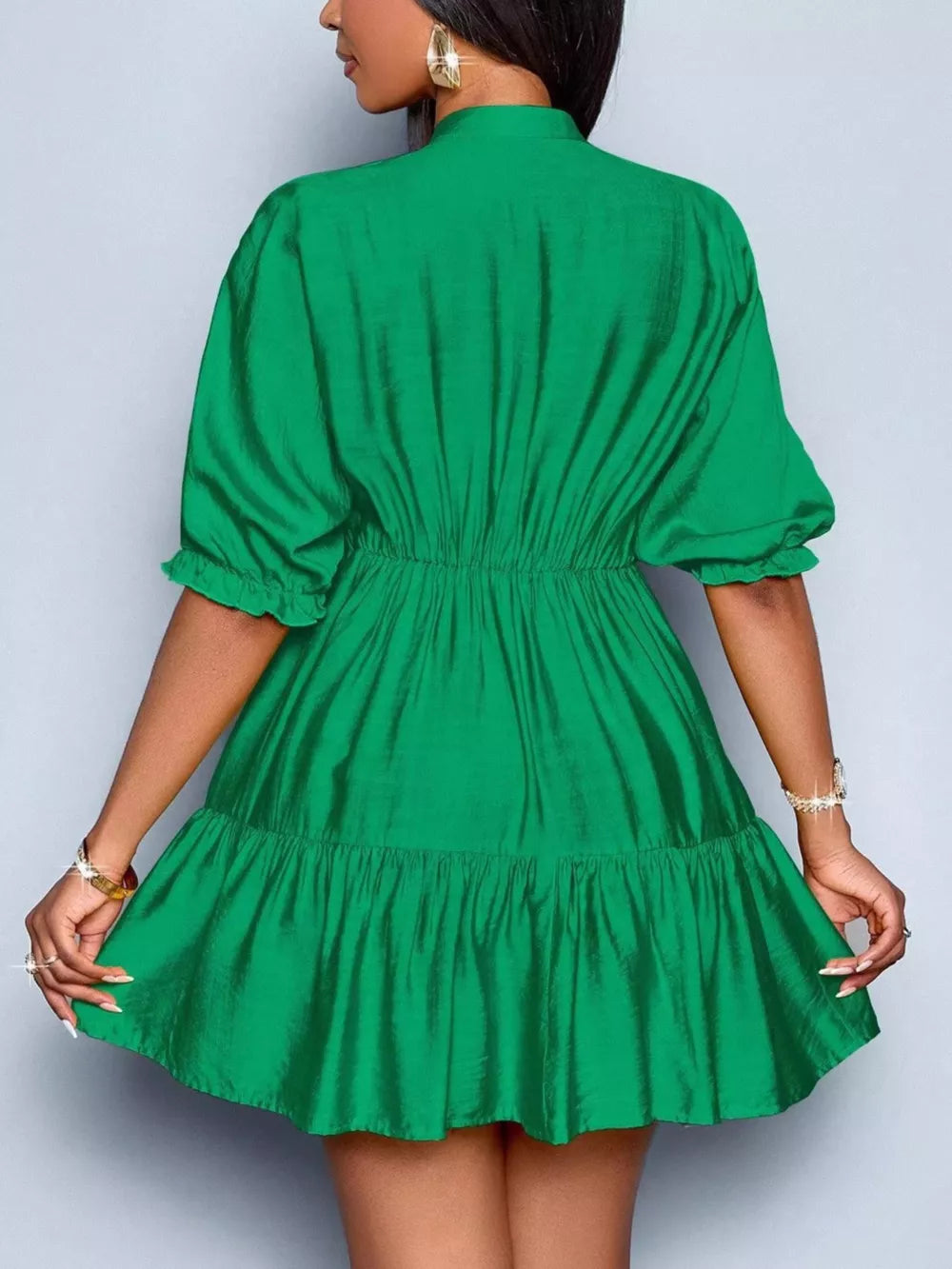 Green tiered mini dress with ruffled sleeves and elastic waist