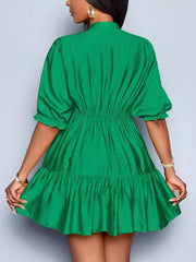 Green tiered mini dress with ruffled sleeves and elastic waist