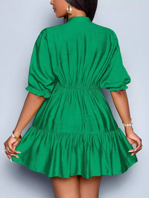 Green tiered mini dress with ruffled sleeves and elastic waist
