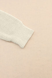 Relaxed knit v-neck pullover sweater in beige with ribbed cuff detail