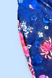 Ombre button-down dress in indigo with a floral print and side pocket detail.