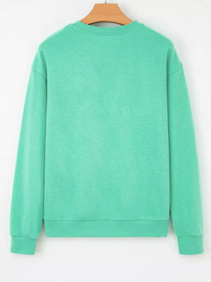65% polyester, 35% cotton Care instructions: Machine wash cold sweatshirt in mint green with relaxed silhouette