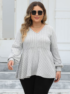 Light gray ribbed peplum blouse with blouson sleeves and v-neck