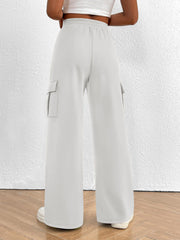 Gray high waist cargo sweatpants with drawstring and side pockets.