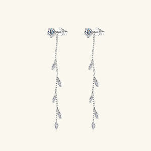 Silver dangling crystal vine earrings with delicate chain and leaf-shaped accents.