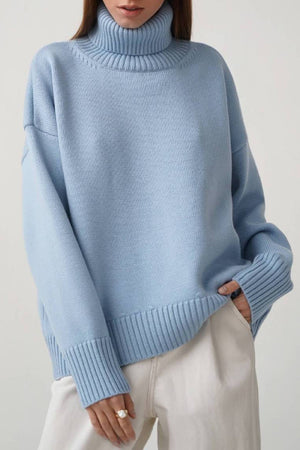 Relaxed roll-neck sweater in Misty Blue with a boxy knit and ribbed cuffs and hem.