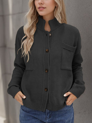 Gray acrylic knit cardigan with stand collar, buttons, and chest pockets.