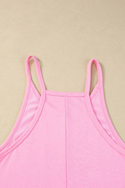Pink spaghetti strap romper with a square neckline and patch pockets