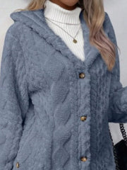 Blue hooded teddy trench coat with cable knit texture and button detail.