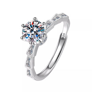 Sterling silver ring with brilliant moissanite center stone and accent stones