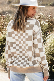 Geometric knit checkerboard pullover sweater in mocha and cream with crew neck and long sleeves.