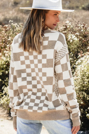 Geometric knit checkerboard pullover sweater in mocha and cream with crew neck and long sleeves.