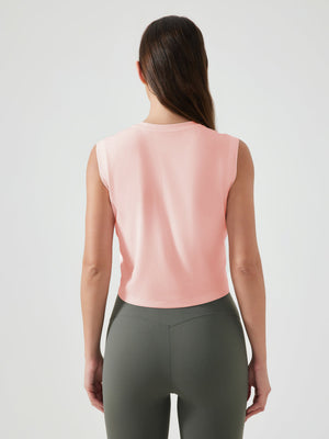Sculpted crop active muscle tee in watermelon pink, sleeveless, crew neck, back view.