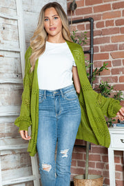 Open-knit slouchy cardigan in matcha green with open weave details and balloon sleeves.