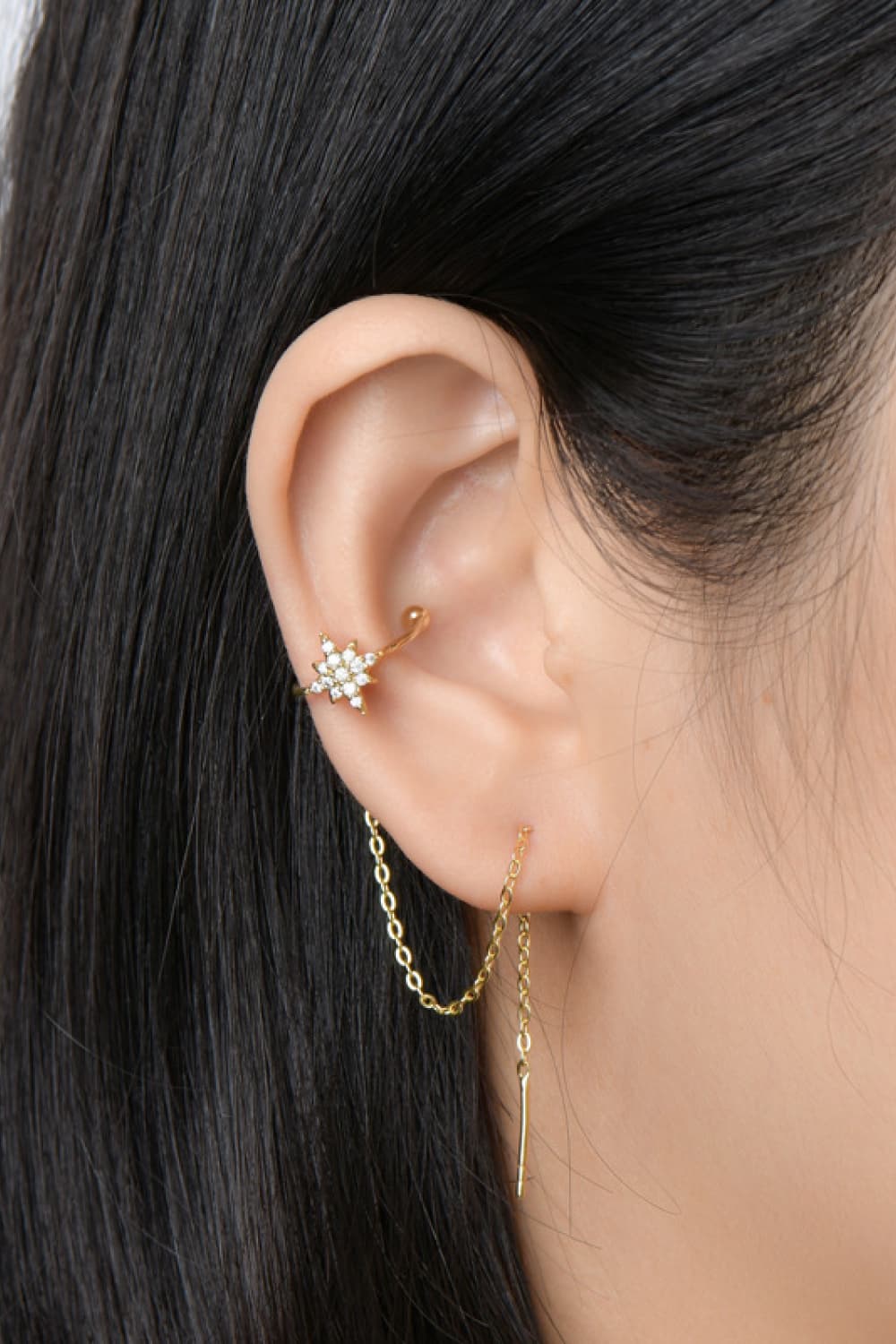 Gold moissanite starburst ear climber with a double chain drop earring.