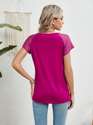 Hot pink polyester blouse with lace short sleeves and a round neckline.
