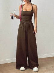 Coffee brown wide-leg jumpsuit with ruched waist and spaghetti straps.