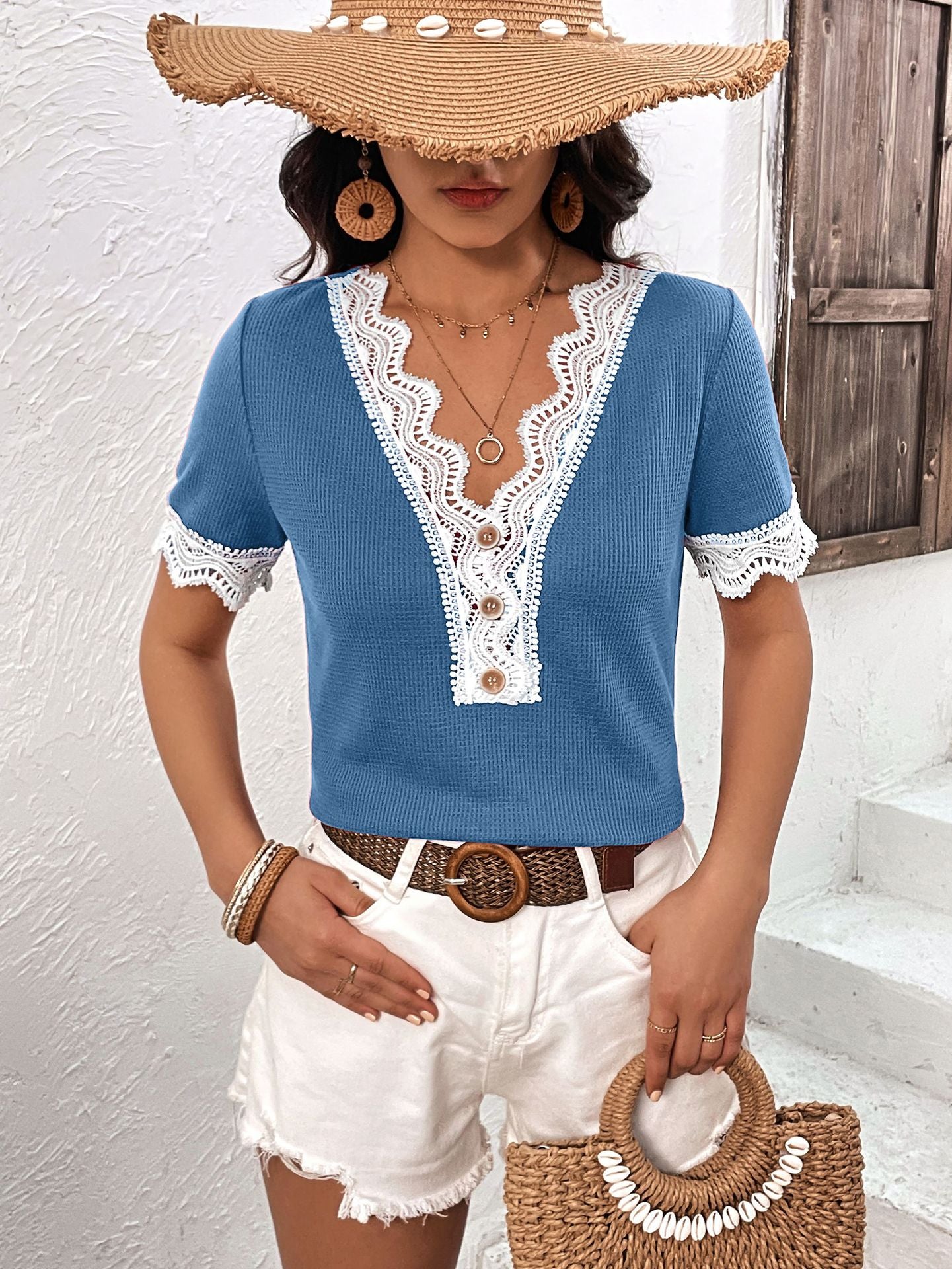 Cerulean waffle knit henley with lace trim and button detail.
